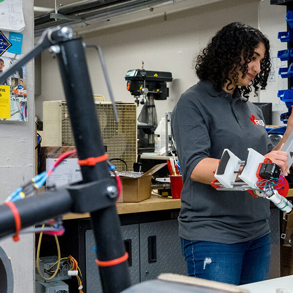 robotics team work on mars rover carrousel